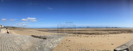 Photo for Panoramic View of Asnelles Beach and the Remains of the WW2 D-Day Mulberry Harbour. Arromanches, France, July 5, 2023. - Royalty Free Image