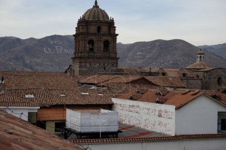 Photo for Church and Convent of Santo Domingo of Guzmn seen over the rooftops of Cusco. Cusco, Peru, October 7, 2023. - Royalty Free Image