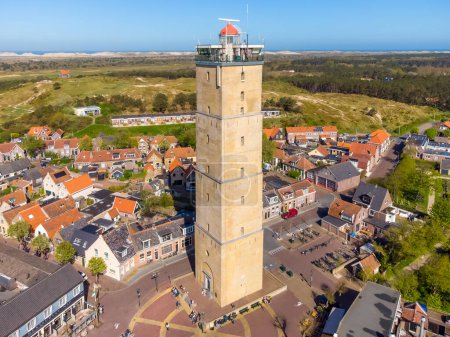 Photo for Lighthouse Brandaris on the island Terschelling, the Netherlands. Horizontal image of this historic brick lighthouse under a blue sky in summer. Wadden island Terschelling. High quality photo - Royalty Free Image