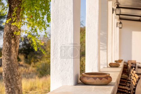 Photo for Vertical image of counter top or bar with outdoor views on African bush in morning light. High quality photo - Royalty Free Image