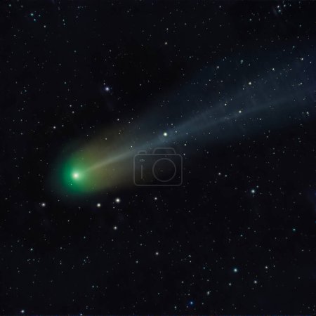 Photo for Astrophoto of periodic comet 12P Pons Brooks in the night sky. Green nucleus and tail of ion, dust and vapour illuminated by the sun in front of star field in space - Royalty Free Image
