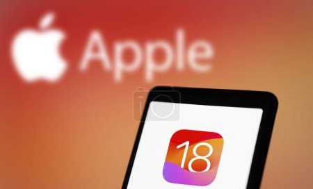 Photo for Dhaka, Bangladesh- 05 Apr 2024: Apple IOS 18 icon on smartphone and apple logo in the background. - Royalty Free Image