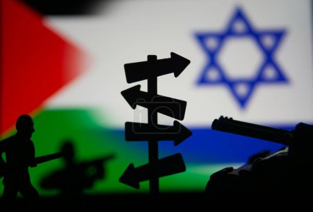 Representación del conflicto palestino israelí, representado por soldados de juguete y una señal con flechas.