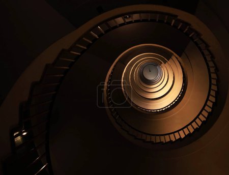 Spiral staircase in a tall multi-floor house, in the form of a "golden ratio", architecture, concept
