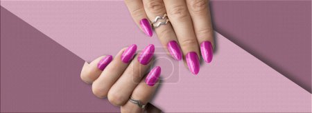 Photo for Beautiful woman's hands with springtime pink with glitter nail art - Royalty Free Image