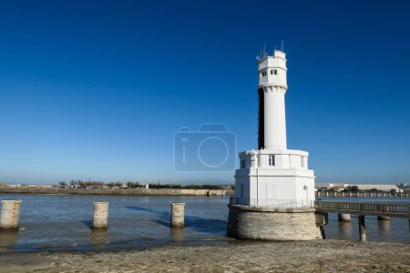 Photo for White lighthouse next to the port of Bayonne in Anglet, in the Basque Country - Royalty Free Image