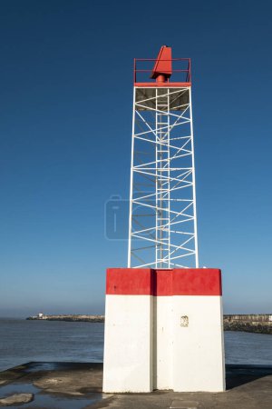 Photo for Lighthouse at Aglet with an embankment and another lighthouse in the background at Boucau in the Basque Country in France - Royalty Free Image