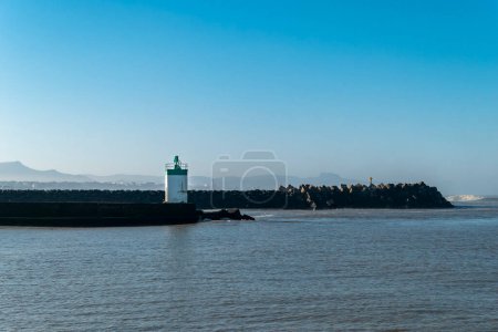 Photo for Dike at Anglet in the Basque Country, France with some more dikes and lighthouses in the background - Royalty Free Image