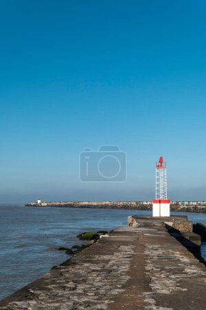 Photo for Dock on the Little Digue beach in Boucau with a lighthouse in front and another one in the background - Royalty Free Image