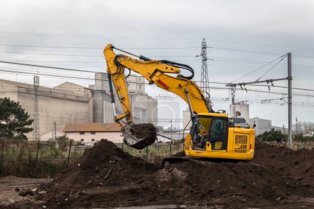 Rotary backhoe loader for preparing land and residential foundations