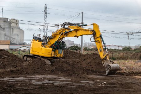 Residential land preparation: Use of a rotating backhoe to prepare land and foundations for residential buildings