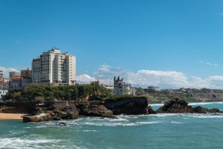 Panoramic view over part of the city of Biarritz with the beach, some rocks and part of the city in the background in France