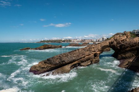 The stunning coastline of Biarritz: Beaches, rocks and part of the city in the background in France