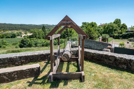 Trebuchet, a type of medieval catapult used primarily during sieges to launch large stones or other projectiles against enemy walls or buildings