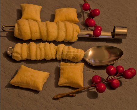 Original homemade puff pastry cookies with kitchen utensils