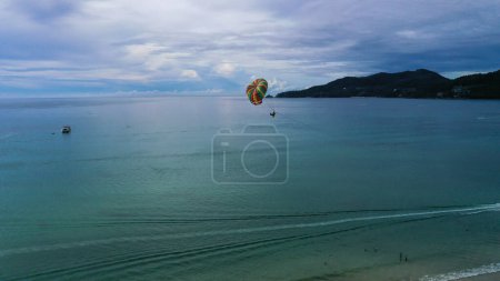 Photo for Sea Aerial view cloudy blue sky, blue sea. Aerial view a tourist play parasailing. - Royalty Free Image