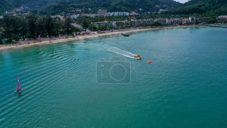 Photo for Aerial view of Patong beach with tourist enjoying the beach and watersport activity - Royalty Free Image