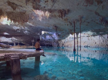 Foto de Cenote taak bi ha in tulum mexico natural underground swimming hole in a cave - Imagen libre de derechos