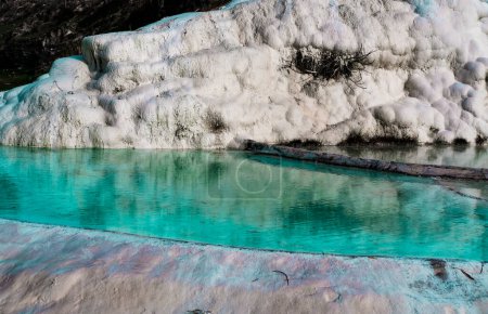 Photo for Hot spring limestone white pools, hydrothermal or geothermal springs in pamukkale, Turkey natural heritage, winter season view - Royalty Free Image