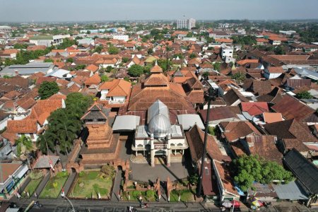 Photo for Kudus, Indonesia. August 22, 2022. Aerial view of Masjid Menara Kudus. The mosque is a historic building relic of Wali Songo, Sunan Kudus. The architecture is Hindu and Islamic style. - Royalty Free Image