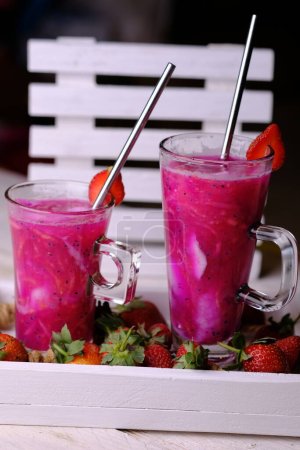 Es Buah Es Teler, a fresh mix of tropical fruits such as young coconut, dragon fruit, basil seeds, cantaloupe, melon. This drink is popular in Indonesia