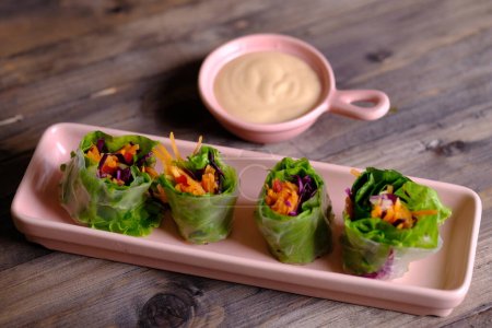Lumpia Vietnam. Vietnamese Spring Rolls, made from shavings of fresh raw vegetables, carrots, lettuce, purple cabbage, onions, peppers, stuffed with chicken, tuna, or shrimp. wrapped in a rice roll.