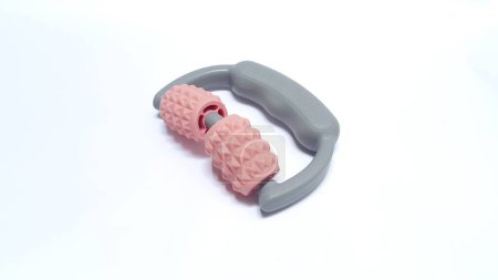Foto de Roller massage tool. Plastic massage tool on isolated white background. Tool for body massage - Imagen libre de derechos