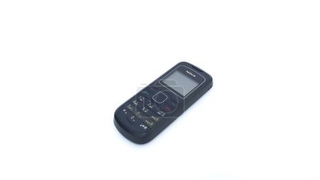 Foto de Close up of Nokia cellphone isolated on white background. Nokia 1202 series. The old type. Jakarta, Indonesia - January 19, 2023. - Imagen libre de derechos