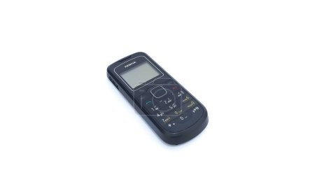 Foto de Close up of Nokia cellphone isolated on white background. Nokia 1202 series. The old type. Jakarta, Indonesia - January 19, 2023. - Imagen libre de derechos