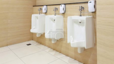 Photo for Toilet men's room. Row of outdoor urinals men public toilet. Close up white urinals in men's bathroom. - Royalty Free Image
