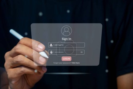 Hand holding a pen to login username and password on virtual screen. User sign registration page concept.