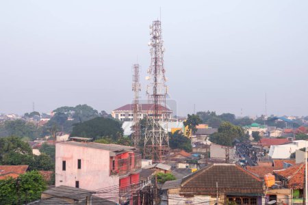 Photo for Jakarta, Indonesia - May 09, 2024: Telecommunication tower in the middle of suburban area in South Jakarta - Royalty Free Image