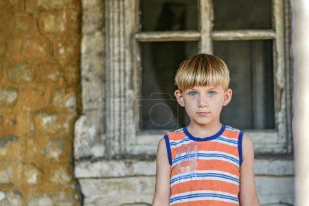 Photo for Children in a burnt house lost their homes as a result of hostilities and natural disasters. - Royalty Free Image