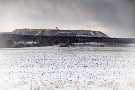 Mining waste dump and field in wintertime in Germany.