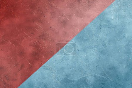 Abstract texture with a bold diagonal division of scratched red and serene blue, symbolizing contrast