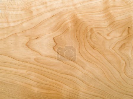 This image features the delicate and flowing grain patterns of light natural wood, showcasing its smooth surface and subtle color variations.