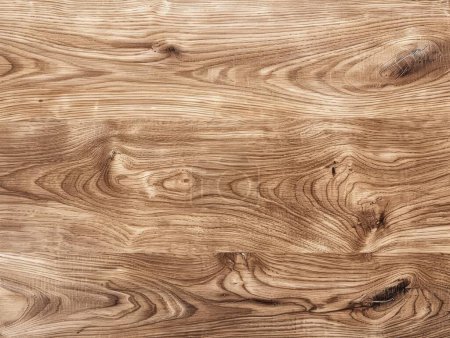This image features a close-up view of ash wood grain, displaying its rich textures and complex swirl patterns.