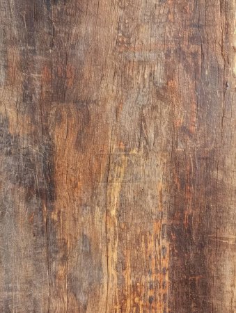 This detailed image showcases the rich textural depth of aged deep brown wood.