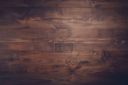 This image highlights the beauty of dark stained wooden planks, showing off the rich grain detail and deep tones.