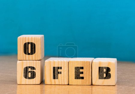 Foto de Cube shape calendar for February 06 on wooden surface with empty space for text,cube calendar for december on wood background - Imagen libre de derechos