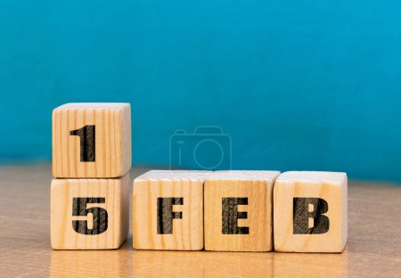 Foto de Cube shape calendar for February 15 on wooden surface with empty space for text,cube calendar for december on wood background - Imagen libre de derechos