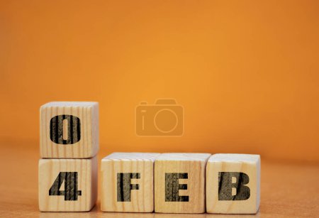 Foto de Cube shape calendar for February 04 on wooden surface with empty space for text, new year Wooden calendar with date, January cube calendar on wooden surface with copy space. - Imagen libre de derechos