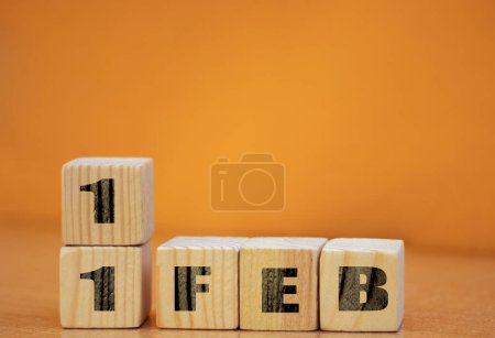 Photo for Cube shape calendar for february 11 on wooden surface with empty space for text, new year Wooden calendar with date, February cube calendar on wooden surface with copy space. - Royalty Free Image