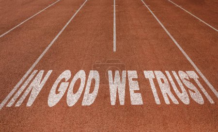 Téléchargez les photos : In God We Trust written on running track, New Concept on running track text in white color - en image libre de droit