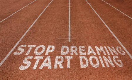 Stop Dreaming Start Doing written on running track, New Concept on running track text in white colour