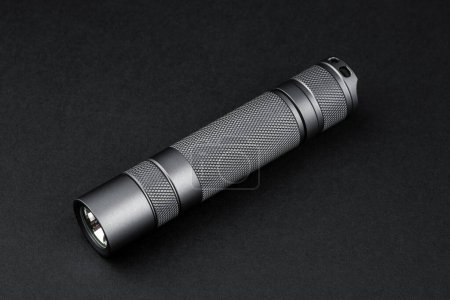 Modern aluminum LED Pocket Flashlight isolated on white background. 