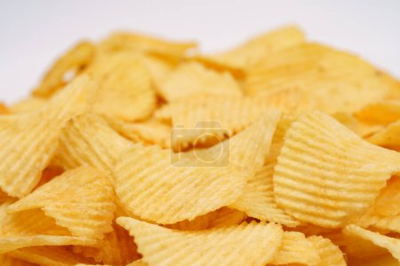 Patatas fritas crujientes en macro. Las papas fritas doradas se cierran. Snack de patata para comida rápida poco saludable. 