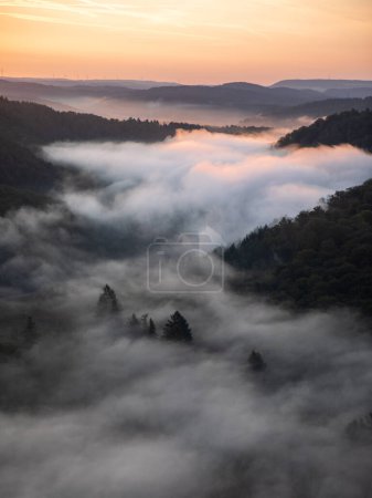 Photo for Foggy Saarschleife river at sunset in Saarland, Germany - Royalty Free Image