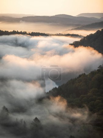 Photo for Drone view of foggy Saarschleife river in Saarland, Germany. - Royalty Free Image