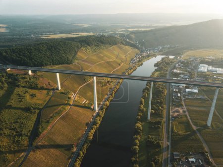 Building of Hochmoselbruecke (High Moselle Bridge) between Uerzig and Zeltingen-Rachtig, Moselle, Germany. Aerial view from drone